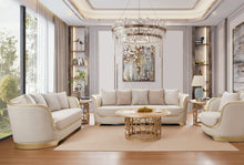 Load image into Gallery viewer, Modern living room with white sofas, a coffee table, and decorative elements.
